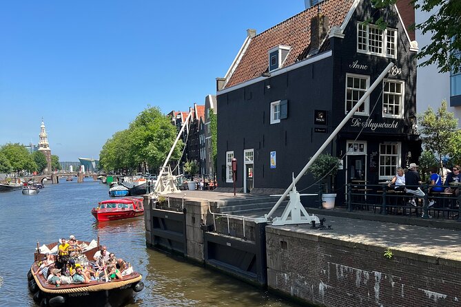 Amsterdam Luxury Boutique Boat tour with Unlimited Beer and Wine - Open-air vibes vs covered roofs (and comfort details)