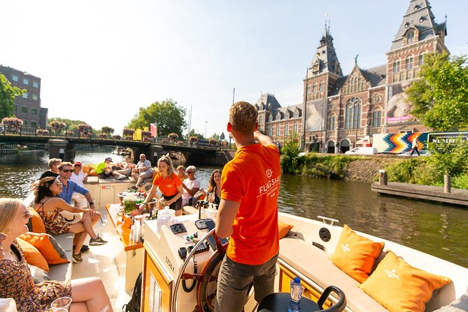 Amsterdam Luxury Canal Cruise + Unlimited Drinks & Bites option - Live guide commentary: the hour moves, and you’ll learn fast