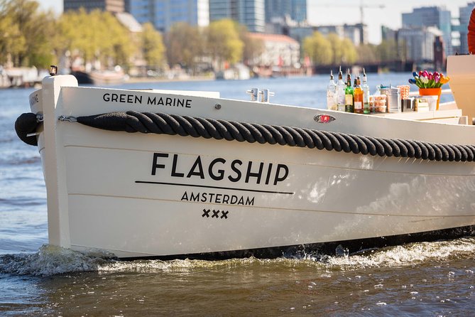 Amsterdam: Saloon Boat Cruise + Unlimited Drinks & Bite option - The rare bridge-through-bridge view on Amsterdam canals