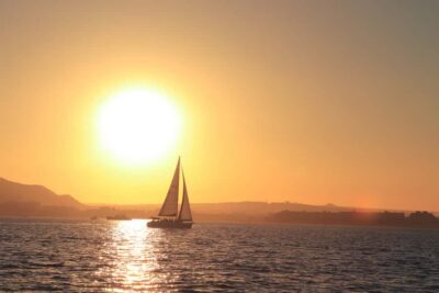 Cabo Luxury Sunset Sailing Adventure with Open Bar - The Beneteau Cyclades deck vibe: drinks, appetizers, and real sailing time