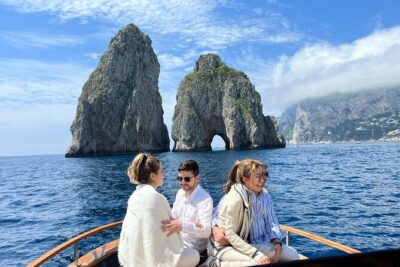 Capri in a Day All Inclusive Premium Boat Tour + City Visit - Spiaggia Marina Grande and Bagni di Tiberio: Capri starts with sea and sand