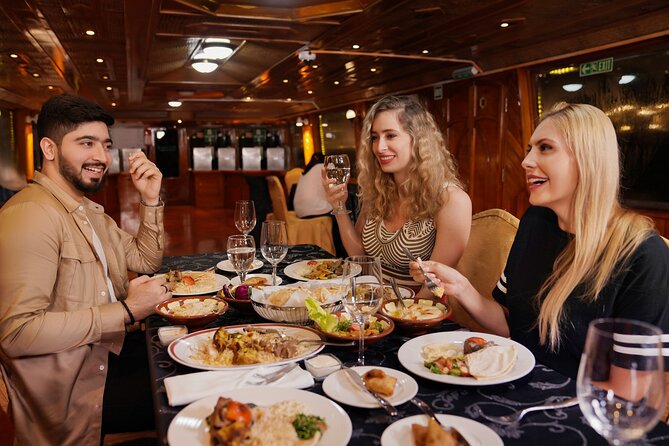 Dubai Creek Luxury Dhow Dinner Cruise with Optional Transfer - What you’ll see glide past: wind towers, minarets, and lit bridges