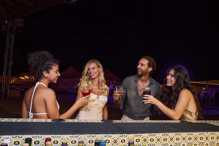 Dubai: Desert Safari, Quad Bike & Premium Camp Experience - Noble Camp dinner: gourmet buffet, grill station, and that fire-show energy