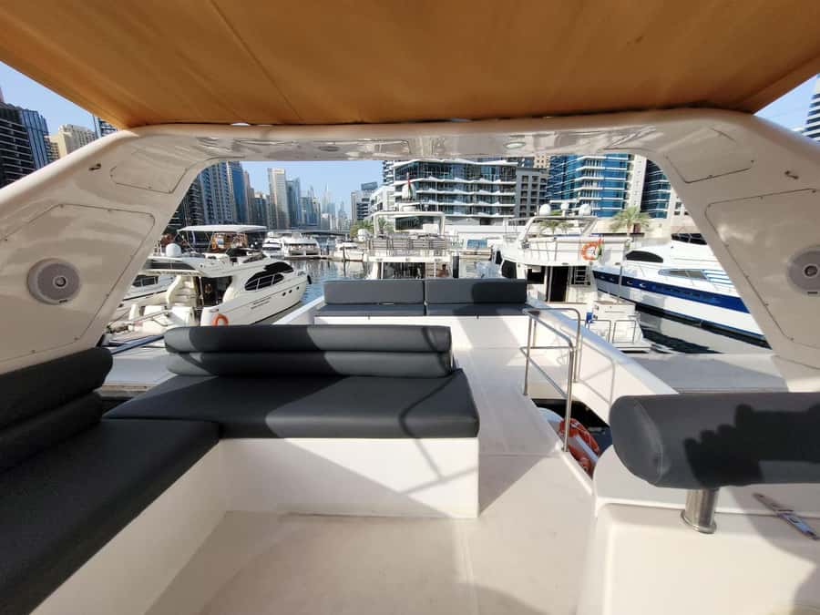 Dubai Marina luxury Yacht Tour: AinDubai,JBR &Harbour(1Hour) - Getting There: Al Raheem Mosque, Manchester Tower, and the Splash T-Shirt Team