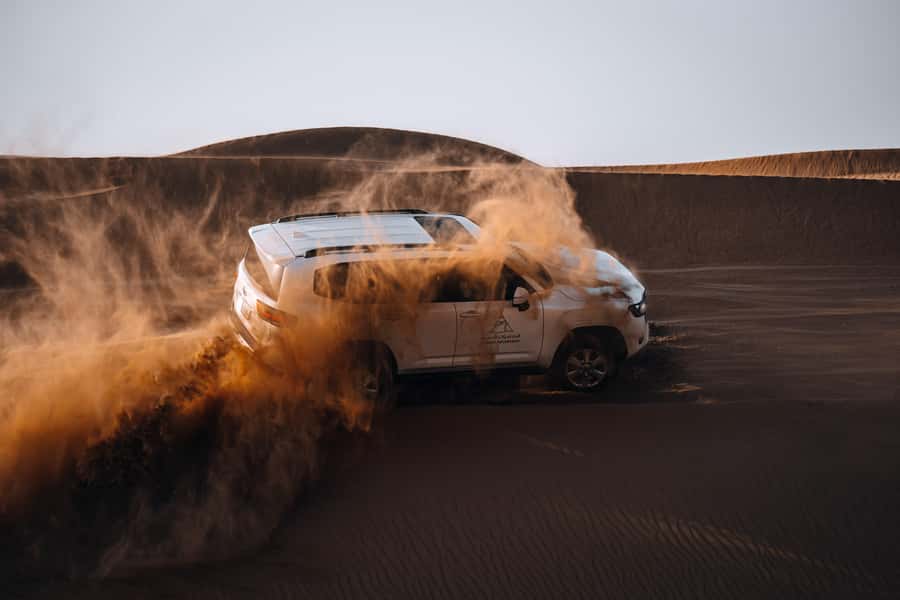 Dubai: Premium Desert Safari, Camel Ride, BBQ & Sandboarding - Sunset Viewpoint: Soft Drinks, Golden Photos, and Optional Aperol