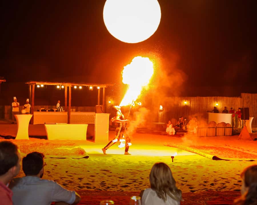 Dubai: Premium Desert Safari, Camel Ride, BBQ & Sandboarding - Live Desert Entertainment: Belly Dance, Tanoura, and a Fire Show
