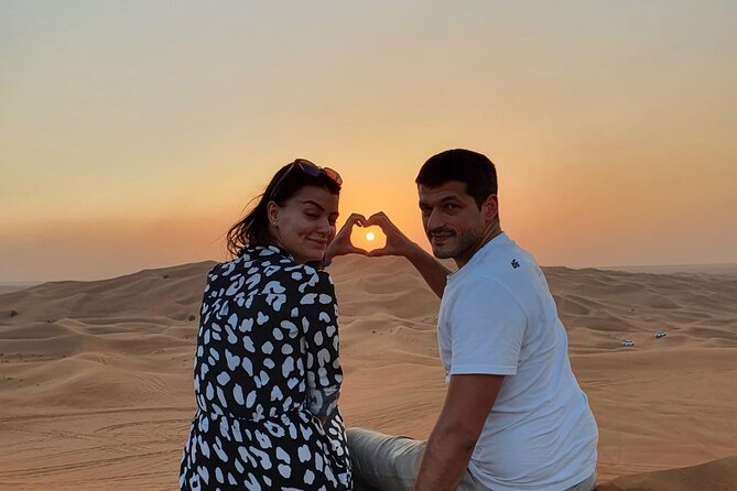 Dubai Premium Red Dunes Safari Camel Ride and BBQ Dinner - Sandboarding and sunset photo stops: getting the shots without stress