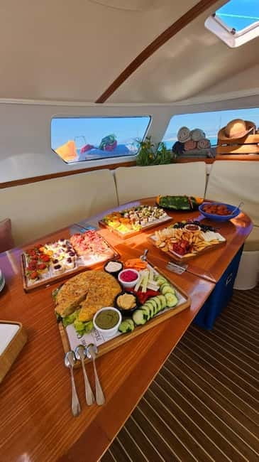 From Palma: Luxury Catamaran Group Tour with Tapas & Drinks - Tapas and Drinks: Included Food, Real Value, and What Costs Extra