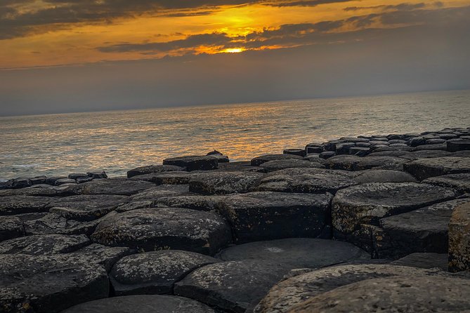 Giants Causeway Tour from Belfast + FREE Belfast Mural Tour - Dunluce Castle ruins and the viewpoint combo