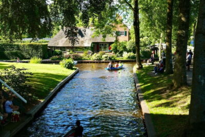 Giethoorn : Luxury Private open boat tour with local captain - Where You Glide: Bridges, Thatch Roof Houses, and Swan-Friendly Water