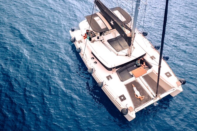 Half Day Premium Catamaran Cruise in Santorini including Oia - Your route makes sense: Red Beach, hot springs, and caldera water