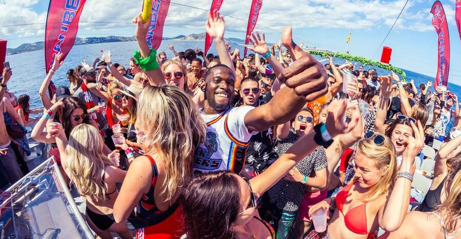 Ibiza: Ocean Club Boat Party with Premium Drinks, Food, & DJ - Swim stop in turquoise water: flips for the brave, floats for everyone else