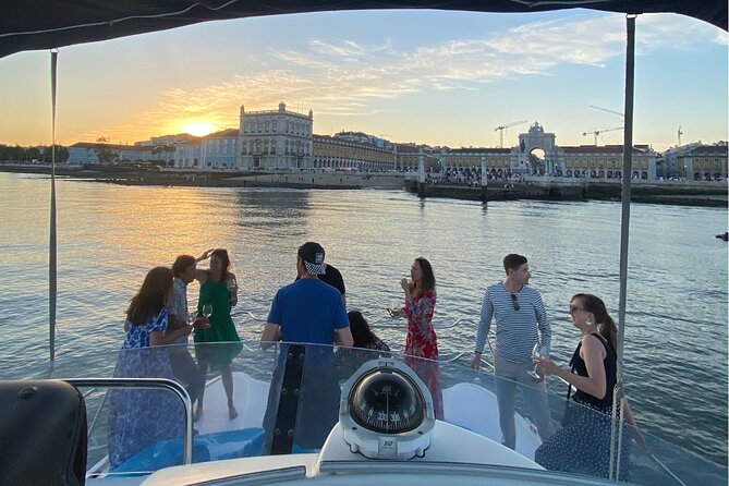 Lisbon: Catamaran Luxury Sunset and Wine Tour - The big photo moment: 25 de Abril and Praça do Comércio