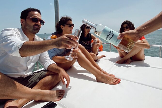 Lisbon: Catamaran Luxury Sunset and Wine Tour - The on-board vibe: comfort, attentive service, and wine that keeps flowing