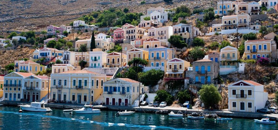 Luxury Boat Trip to Symi Island with Swimming at St. George - The Symi harbour reveal: your 3 hours for streets, photos, and shade