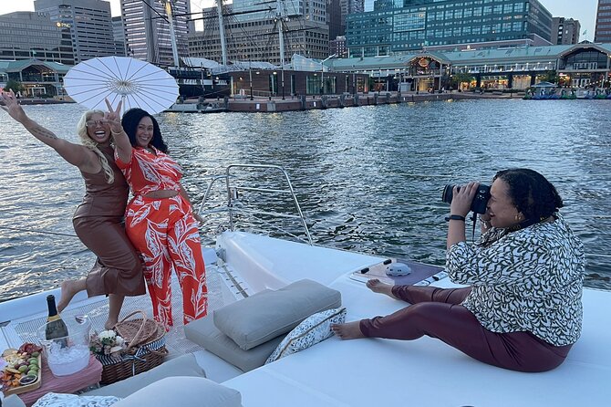 Luxury Catamaran Private Tour Baltimore Harbor - National Aquarium at night: neon blue moments