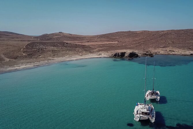 Luxury Catamaran Semi private cruise with meals & drinks and transportation. - The catamaran ride: Aegean views, pirates island passing, and drinks