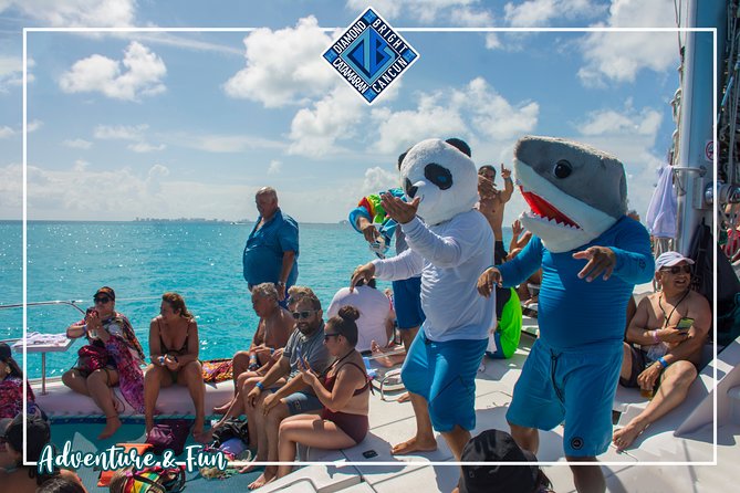 Luxury Catamaran tour to isla mujeres with transportation from Tulum - Isla Mujeres Stop: Snorkeling, Beach Club Access, and Town Time