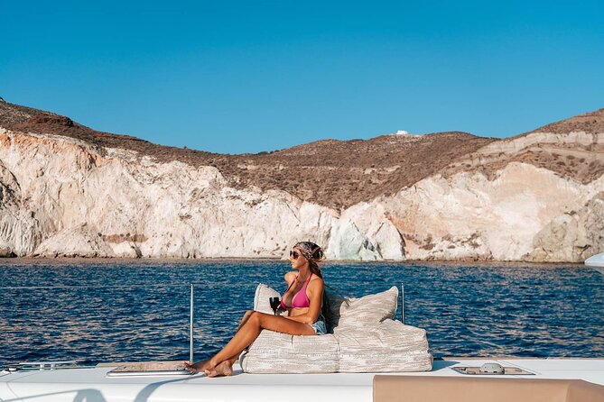 Luxury Santorini Sunset Cruise: Dinner, BBQ, Open Bar, Transfers - Luxury Santorini sunset cruise: dinner, BBQ, and open bar in motion