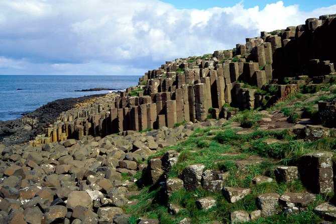 Luxury Tours Belfast. Full day Private Hire Tour for 2- 6 people - Dunluce Castle at sunset: short stop, big atmosphere