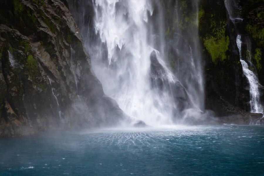 Milford Sound: Premium Small Group Cruise with Canape Lunch - Getting close to waterfalls and sheer cliff faces (and feeling the spray)