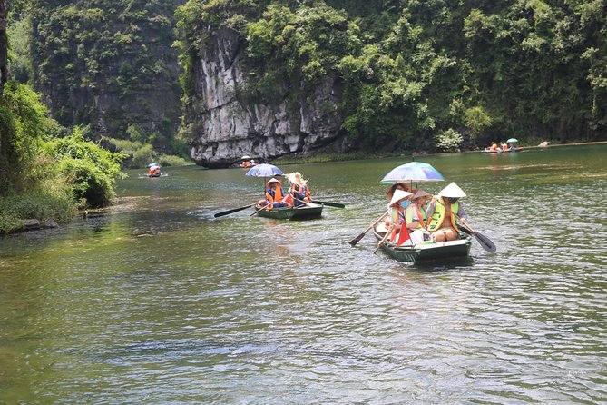Ninh Binh Luxury Tour 2 Days 1 night by limousine See Hidden Gems - Bamboo boat in Tam Coc: caves, paddies, and photo time that actually works