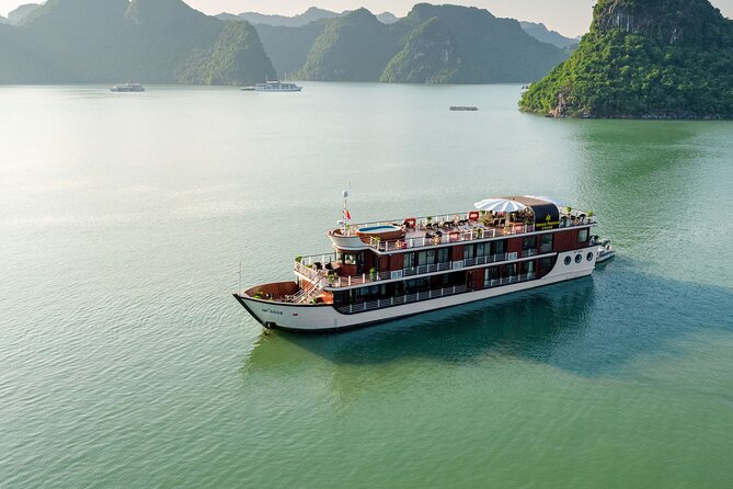 Orchid Premium Cruises Halong Bay 2Days/1Night With 5 Star - Day 1 on the water: check-in, feeder boat transfer, and lunch cruise time