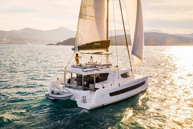 Panormo: Luxury Sunset Catamaran Cruise Sushi & Open Bar - Getting started at Panormos: Prosecco, snacks, and the safety part