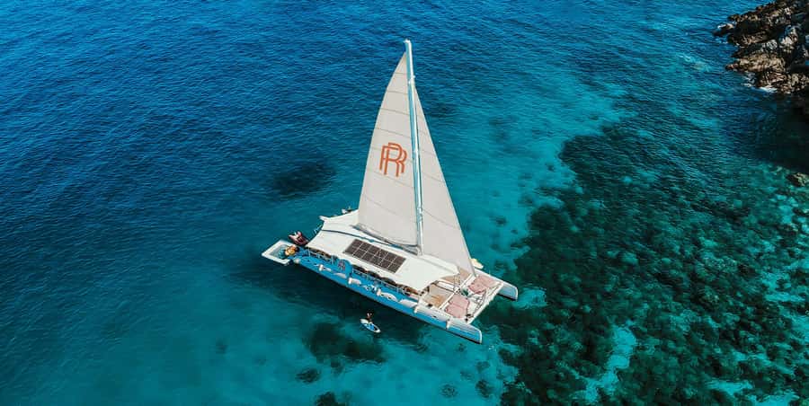 Phuket: Coral & Racha Sunset Luxury Catamaran Party Cruise - Banana Beach on Coral Island: Your Morning Swim Break
