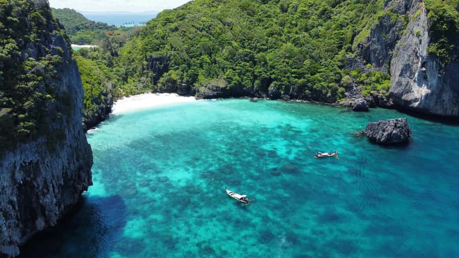 Phuket: Phi Phi, Bamboo & Maithon by Premium Speed Catamaran - Maiton Island and sunset: dolphins if luck is on your side