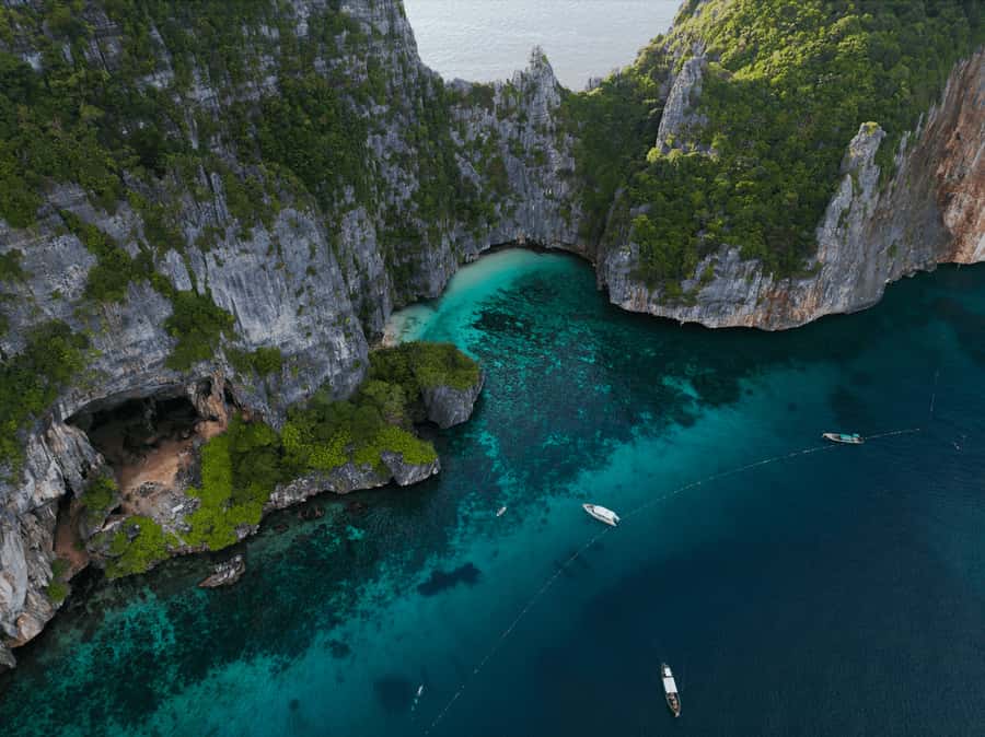 Phuket: Phi Phi Island & Maya Bay Luxury Yacht Day Tour - Sunset cruise back to Phuket Marina, with DJ energy