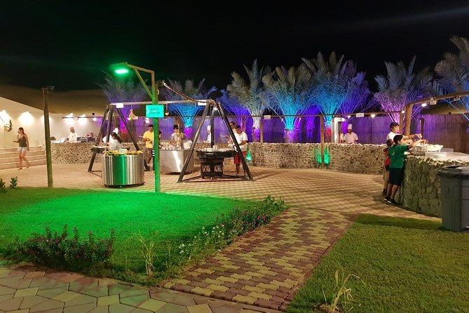 Premium Desert Safari Sharing Transfer with 5<em> Unlimited Buffet – Camp arrival: Arabic coffee, dates, henna, and Arabian costume photos’ /><br />
When you reach camp, it starts with a warm welcome. You’ll typically be offered <strong>Arabic coffee, tea, and dates</strong>. It’s a small ritual, but it’s also a nice decompression moment after the adrenaline of the drive.</p>
<p><p>Then comes the hands-on cultural part.</p>
</p>
<h3 id="henna-painting-is-part-of-the-core-experience">Henna painting is part of the core experience</h3>
<p><strong>Henna painting</strong> is included, and you’ll decorate your hands before dinner. If you care about how your design turns out, the best approach is to choose a style early and sit still so the artist can work cleanly. Henna also adds that “I did something here” feeling, not just “I watched shows.”</p>
<h3 id="camel-ride-included-but-plan-for-a-short-one">Camel ride: included, but plan for a short one</h3>
<p>You get a <strong>camel ride</strong> as part of the included experience, plus costume/photo moments where you can dress up in Arabian-style looks for pictures.</p>
<p><p>Just keep expectations realistic. A few guests described the camel portion as short, with optional upgrades for longer rides. The tour operator also mentions they’ve added a free extension (they referenced <strong>five extra minutes</strong>). So if the camel ride is a top priority for you, be ready to ask how long your ride will be before you get on the camel.</p>
</p>
<h2 id="dinner-under-the-stars-unlimited-buffet-seating-style-and-entertainment-flow">Dinner under the stars: unlimited buffet, seating style, and entertainment flow</h2>
<p><img width="669" height="446" decoding="async" src=