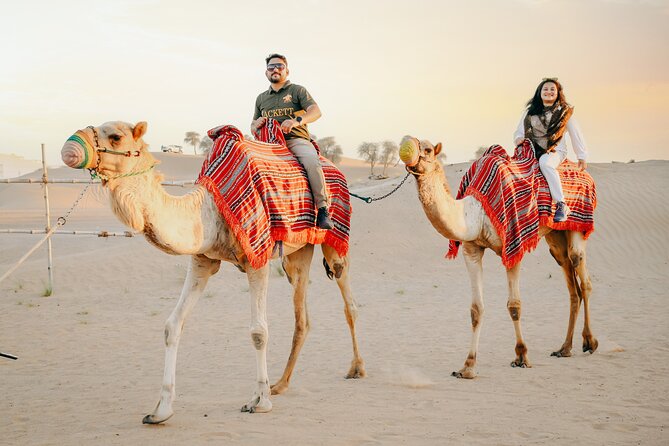 Premium Dubai Desert Safari with Dune Bashing, BBQ, Live Shows - Desert camp time: camel ride, henna, and shisha