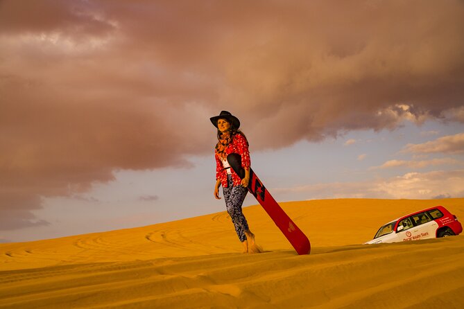 Premium Dubai Red Dunes with quadbike, camel ride and VIP Dinner - Dune bashing, quad biking, and sandboarding: more time on the sand