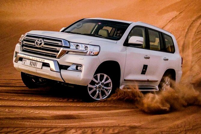 Premium Evening Desert Safari with Quad Bike, Camel Ride and BBQ Dinner - Camp arrival: Arabic tea, henna, dress photos, and the flavor of the night