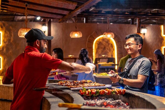 Premium Red Dune Safari with Camel Ride and BBQ in Arabian camp - Camp entertainment: belly dancing, tanoura, and fire shows