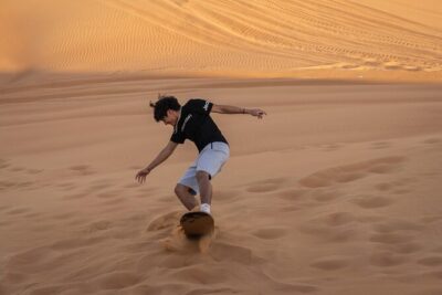 Premium Red Dunes Bashing with Quad Bike, Camel, Falcon &VIP Camp - Dune bashing and sandboarding: the adrenaline half of the day
