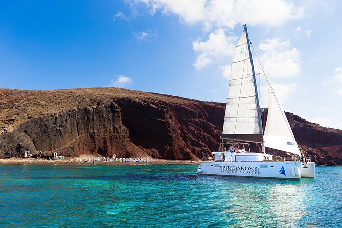 Premium Small-Group Catamaran Cruise with BBQ, Open Bar, Transfer - Following the caldera route: Red Beach, White Beach, and the Venetian lighthouse