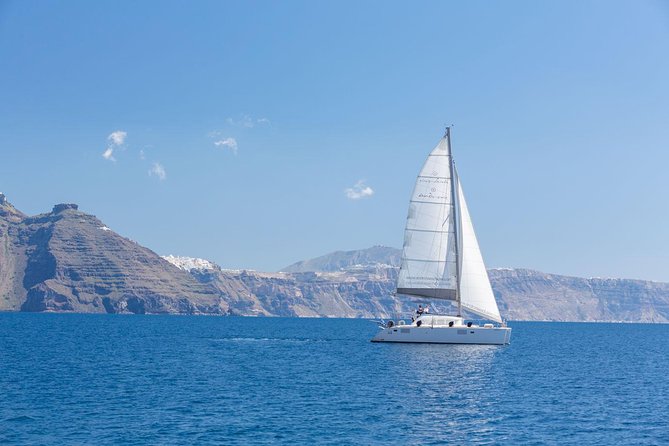 Premium Small-Group Catamaran Cruise with BBQ, Open Bar, Transfer - From Vlychada back across the island: pickup, timing, and drop-off reality