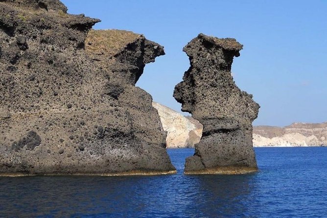 Private Luxury Santorini Catamaran Cruise with Port Pickup - Red Beach swim: red volcanic sand, short and sweet