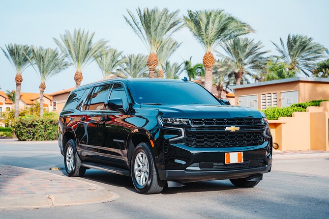 Private Round - Trip Airport Transfer in Aruba Luxury SUV - Name-on-Tablet Pickup: No Guesswork After Customs