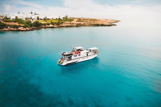 Protaras: St Georgios Presidential Cruise BBQ & 1 drink. 16+ - The Star Stops: Blue Lagoon + Cave Country in Cape Greco