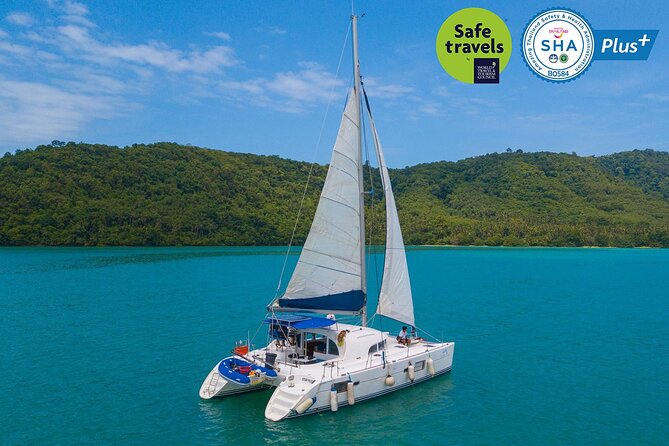Racha and Coral Island One Day Trip + Sunset by Luxury Catamaran From Phuket - Stop 1: Ko He on Coral Island for beach breaks and optional sea sports