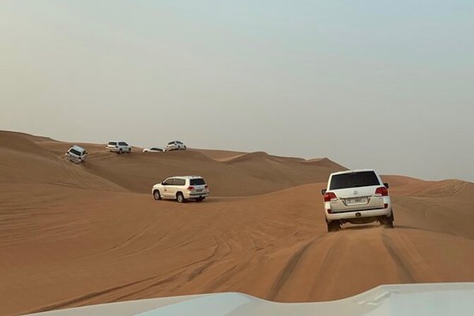 Red Sand Tourism desert safari with premium camp - The sunset photo stop and sandboarding window