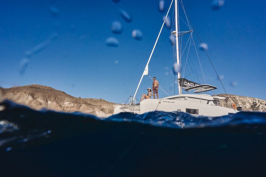 Santorini: Caldera Luxury Catamaran Cruise w/ Meal & Drinks - The Red Beach Stop: Where the Boat Becomes Your Front-Row Seat