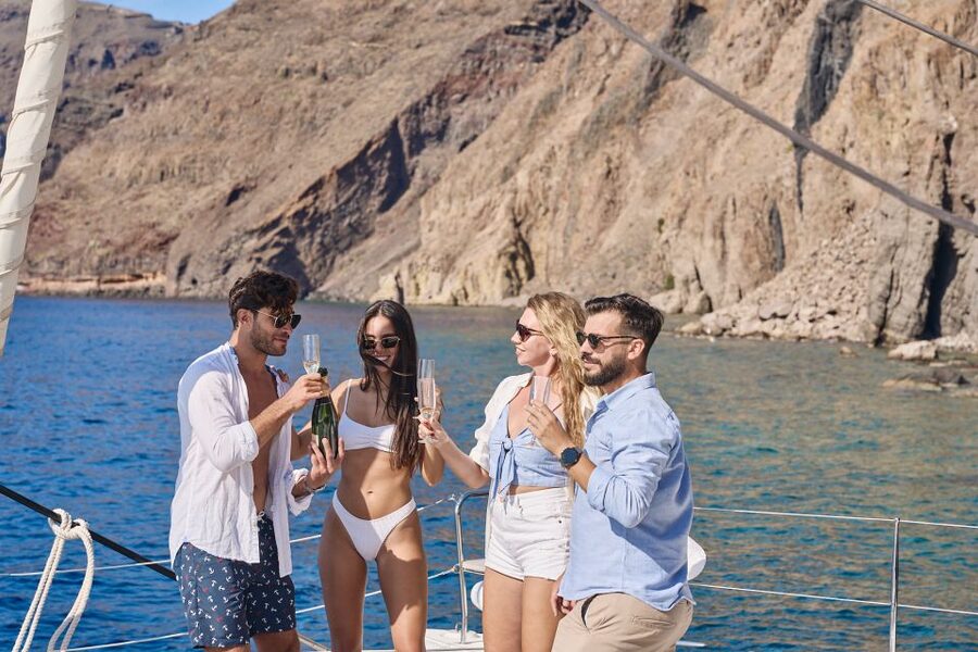 Santorini: Day Luxury Catamaran Cruise with Meal & Drinks - Weather reality: strong winds can change the plan