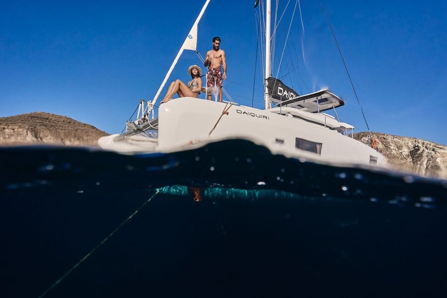 Santorini: Day Luxury Catamaran Cruise with Meal & Drinks - Nea Kameni volcano islets: salty water + BBQ with real Greek flavors