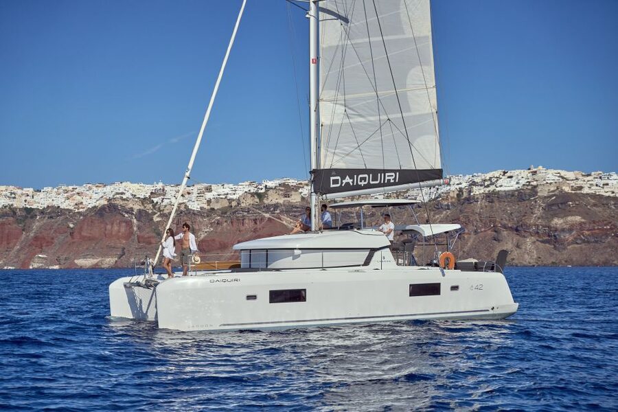 Santorini: Day Luxury Catamaran Cruise with Meal & Drinks - Crew, guide, and the one caution to keep in mind