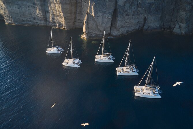 Santorini: Luxury Catamaran Cruise with Fresh Fish BBQ & Drinks - Nea Kameni: your longest swim window, plus dinner on board