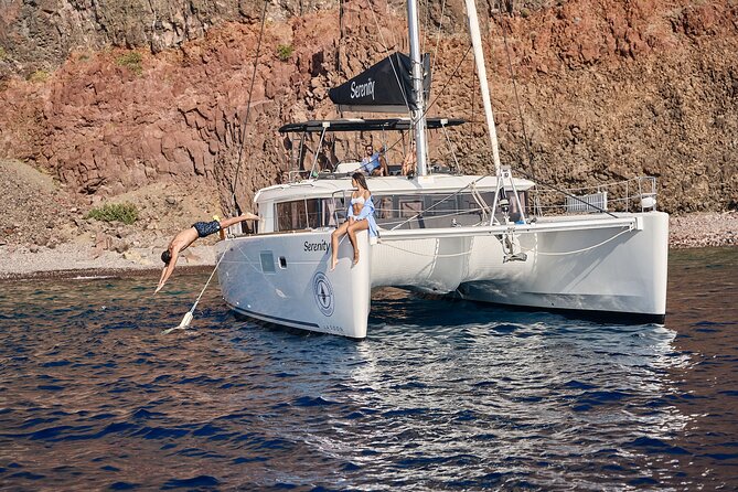 Santorini: Luxury Catamaran Cruise with Fresh Fish BBQ & Drinks - Greek BBQ and unlimited drinks: what’s included, and what it’s like